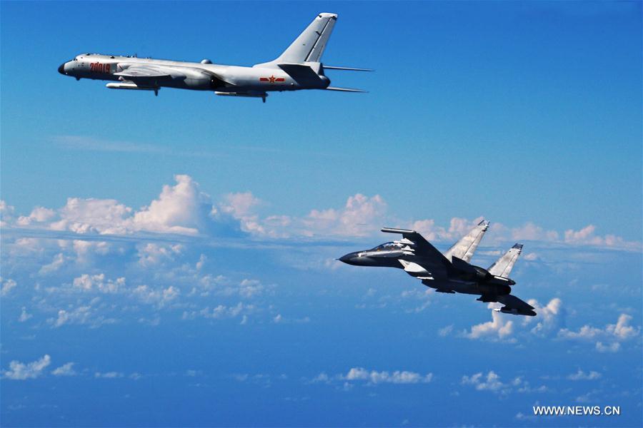 H-6K bombers and Su-30 fighters were among the 40 aircraft involved in the PLA Air Force's drill over the Western Pacific on Sunday. The drill was to test the military's far-offshore combat and assault capabilities.[Photo/Xinhua]
