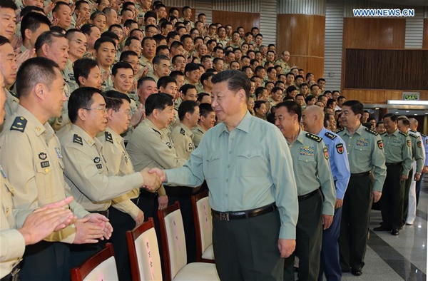 Chinese President Xi Jinping, also general secretary of the Communist Party of China (CPC) Central Committee and chairman of the Central Military Commission (CMC), shakes hands with delegates attending the first People's Liberation Army (PLA) Rocket Force Party congress during his inspection of the PLA Rocket Force, in Beijing, capital of China, Sept. 26, 2016. [Xinhua]