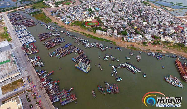 Fishing boats take shelter in a port of Sanya, Hainan Province. 