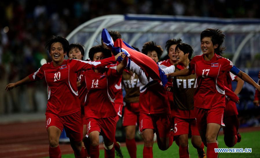 Players of the Democratic People&apos;s Republic of Korea (DPRK) celebrate after their victory in the final against Japan during the FIFA U17 Women&apos;s World Cup in Amman, Jordan, on Oct. 21, 2016. (Xinhua/Mohammad Abu Ghosh) 