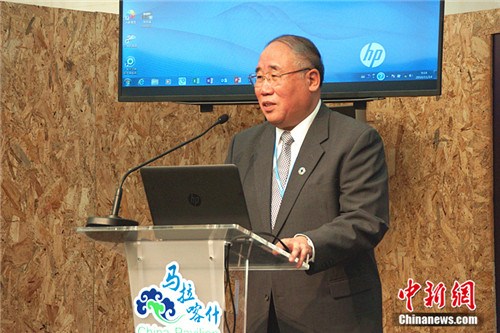 China is ready to make contributions to global efforts in addressing climate change through South-South cooperation, says China's Special Representative on Climate Change Affairs Xie Zhenhua in Morocco, November 14, 2016.