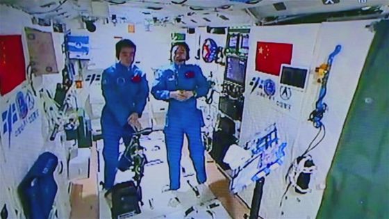Photo provided by Astronaut Center of China shows Chinese astronauts Jing Haipeng (R) and Chen Dong accept their first earth-space interview in Tiangong-2, Nov. 15, 2016. [Photo/Xinhua]