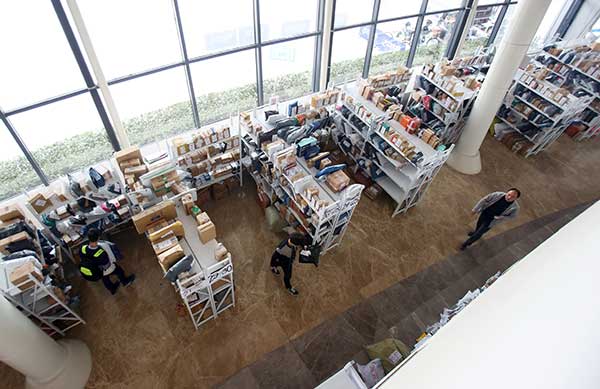 Zhejiang University's Zijingang campus in Hangzhou has converted a gymnasium into a mailroom, as about 200,000 packages are expected to arrive following this year's Singles Day online shopping festival.[Photo by Cheng Hui/For China Daily] 