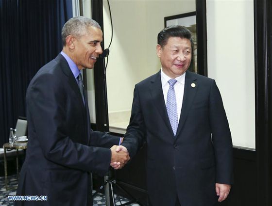 Chinese President Xi Jinping (R) meets with his U.S. counterpart Barack Obama in Lima, Peru, Nov. 19, 2016. [Photo/Xinhua]