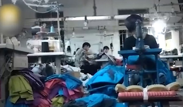 A screenshot of the video showing child laborers working overtime in Changshu, eastern China's Jiangsu Province. [Photo: CRIENGLISH.com]