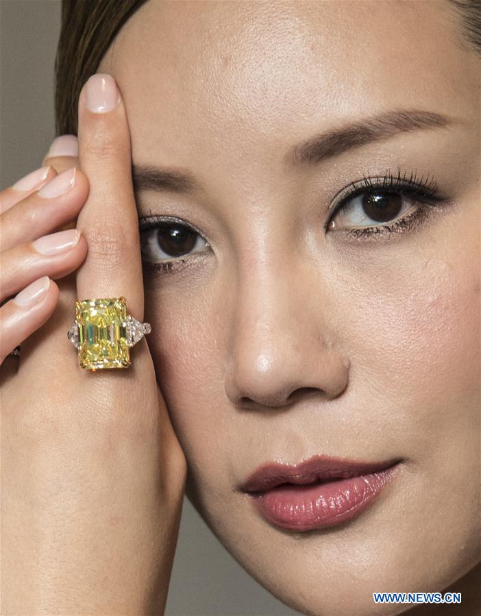 A model displays a 30.16-karat diamond ring during a press conference of Tiancheng International in Hong Kong, south China, Nov. 25, 2016. Tiancheng International will hold an jewellery and jadeite auction event on Dec. 4 for more than 270 items with estimated value exceeding 2 billion Hong Kong dollars (about 258 million U.S. dollars). (Xinhua/Lui Siu Wai) 