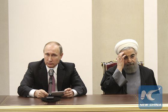 Iranian President Hassan Rouhani (R) and his Russian counterpart Vladimir Putin hold a press conference after their meeting following the third summit of the Gas Exporting Countries Forum (GECF) in Tehran, Iran, on Nov. 23, 2015. [Photo/Xinhua]