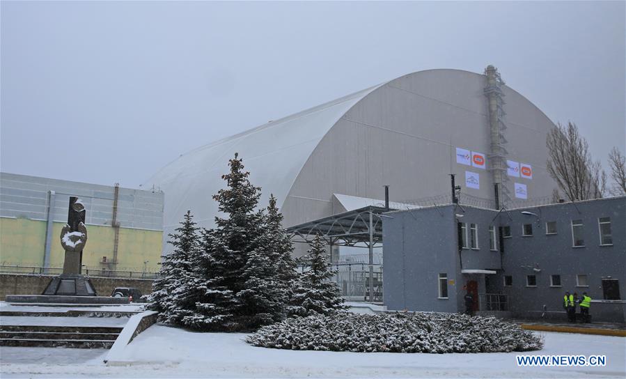 Photo taken on Nov. 29, 2016 shows the new protective cover over the destroyed Chernobyl nuclear reactor No.4 at Chernobyl nuclear power plant, 110 kilometers north of the Ukrainian capital of Kiev. Ukraine on Tuesday unveiled a new protective cover over the destroyed Chernobyl nuclear reactor No.4, which would prevent the leakage of the radiation from the unit during the next century. [Photo/Xinhua]