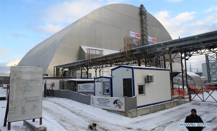 Photo taken on Nov. 29, 2016 shows the new protective cover over the destroyed Chernobyl nuclear reactor No.4 at Chernobyl nuclear power plant, 110 kilometers north of the Ukrainian capital of Kiev. Ukraine on Tuesday unveiled a new protective cover over the destroyed Chernobyl nuclear reactor No.4, which would prevent the leakage of the radiation from the unit during the next century. [Photo/Xinhua]