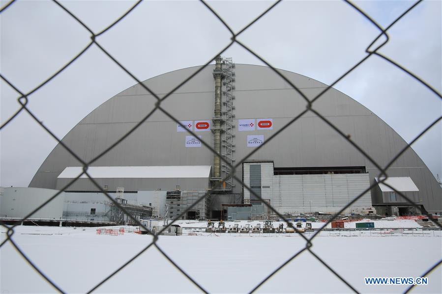 Photo taken on Nov. 29, 2016 shows the new protective cover over the destroyed Chernobyl nuclear reactor No.4 at Chernobyl nuclear power plant, 110 kilometers north of the Ukrainian capital of Kiev. Ukraine on Tuesday unveiled a new protective cover over the destroyed Chernobyl nuclear reactor No.4, which would prevent the leakage of the radiation from the unit during the next century. [Photo/Xinhua] 