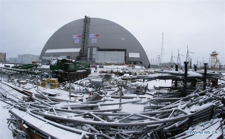 Photo taken on Nov. 29, 2016 shows the new protective cover over the destroyed Chernobyl nuclear reactor No.4 at Chernobyl nuclear power plant, 110 kilometers north of the Ukrainian capital of Kiev. Ukraine on Tuesday unveiled a new protective cover over the destroyed Chernobyl nuclear reactor No.4, which would prevent the leakage of the radiation from the unit during the next century. [Photo/Xinhua]