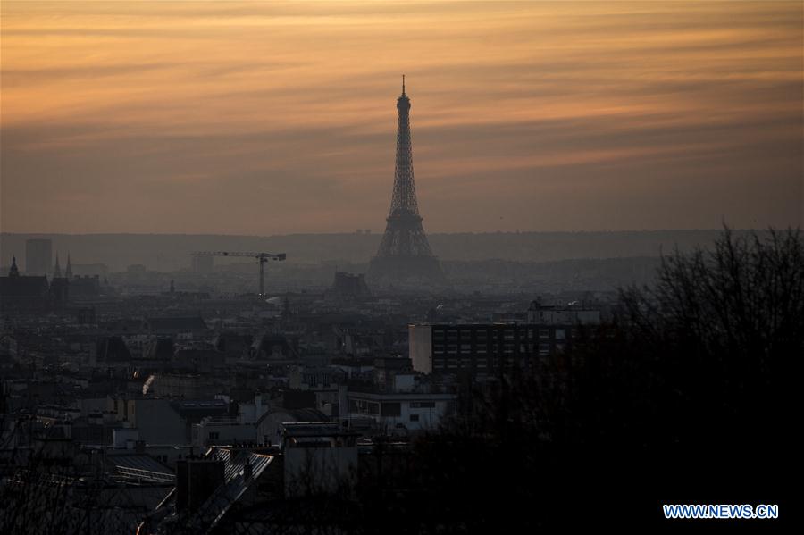 The Eiffel Tower is seen in twilight in Paris, France, Dec. 8, 2016. [Photo/Xinhua]