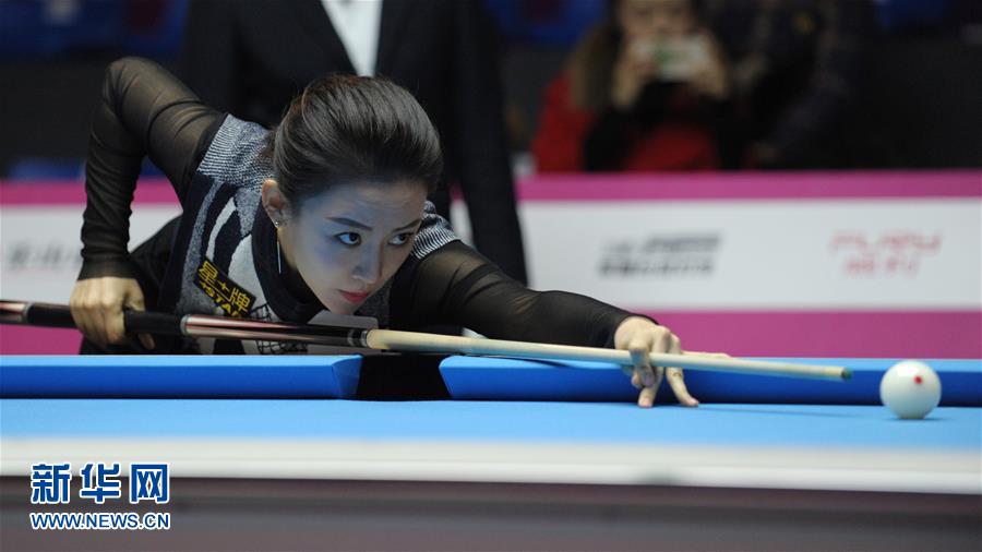 Chinese billiard star Pan Xiaoting competes in 2016 Women's World 9-Ball Championship in Mount Emei City of southwest China's Sichuan Province, Dec. 14, 2016. [Photo/Xinhua]