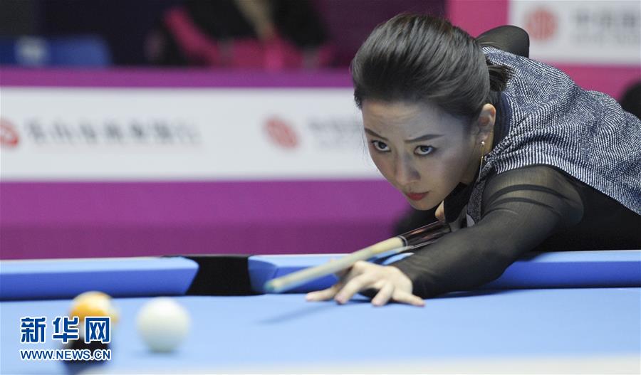 Chinese billiard star Pan Xiaoting competes in 2016 Women's World 9-Ball Championship in Mount Emei City of southwest China's Sichuan Province, Dec. 14, 2016. [Photo/Xinhua]