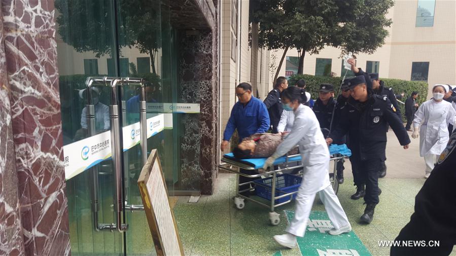 Photo taken by cell phone shows medical staff transfering poisoned patients to the hospital in Bazhong City, southwest China's Sichuan Province, Dec. 18, 2016. Two died and another three were in critical conditions after more than 30 people had breakfast together at a funeral in Miaoya Village of Bazhong city on Sunday, local authorities said. (Xinhua)