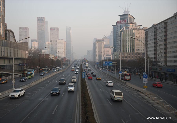 Traffic flows smoothly during rush hours in downtown Beijing, capital of China, Dec. 19, 2016. Beijing activated its first red alert for smog this winter under which the 'Odd-even' car restriction is in force, and additional public transportation has been arranged, with more buses running for longer. [Photo/Xinhua]