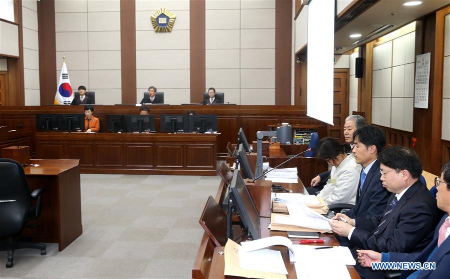 Choi Soon-Sil (4th R), the jailed confidante of impeached South Korean President Park Geun-hye, attends her first court hearing in Seoul, South Korea, on Dec. 19, 2016. [Photo/Xinhua]