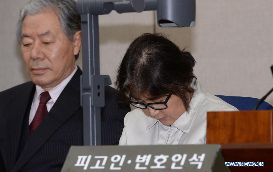 Choi Soon-Sil (R), the jailed confidante of impeached South Korean President Park Geun-hye, attends her first court hearing in Seoul, South Korea, on Dec. 19, 2016. [Photo/Xinhua]