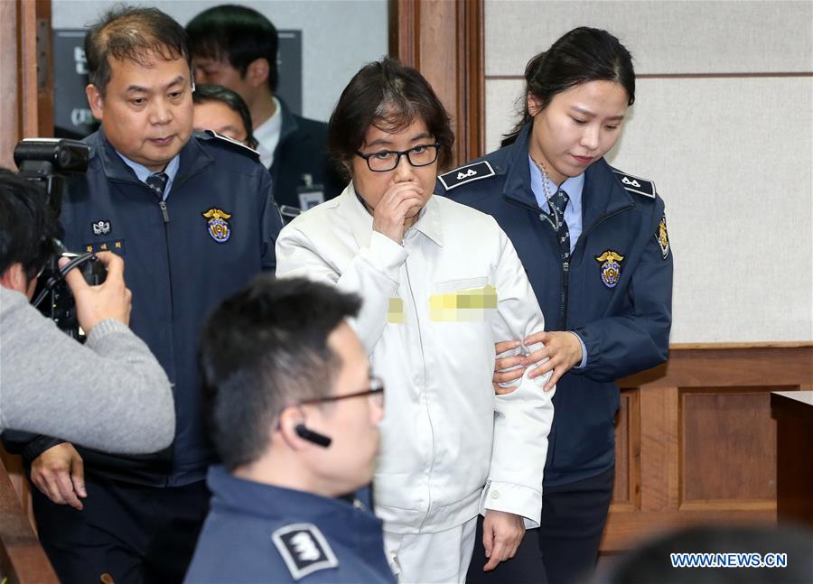 Choi Soon-Sil (2nd R), the jailed confidante of impeached South Korean President Park Geun-hye, arrives for her first court hearing in Seoul, South Korea, on Dec. 19, 2016. [Photo/Xinhua]