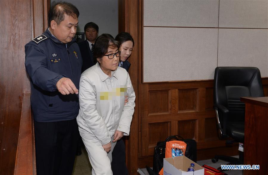 Choi Soon-Sil (front), the jailed confidante of impeached South Korean President Park Geun-hye, arrives for her first court hearing in Seoul, South Korea, on Dec. 19, 2016. [Photo/Xinhua]