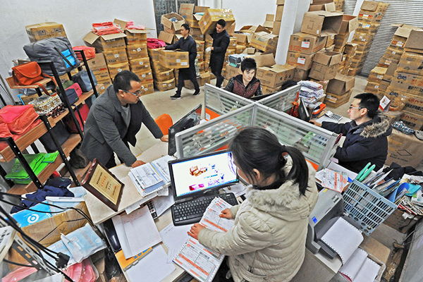 Employees of an online store process orders in Qingyanliu Village, east China's Zhejiang Province on Dec 29, 2015. [Photo/Xinhua]