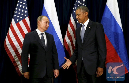U.S. President Barack Obama extends his hand to Russian President Vladimir Putin during their meeting at the United Nations General Assembly in New York September 28, 2015. [File photo/Xinhua]