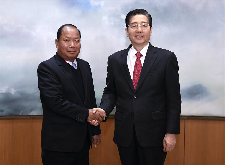 China's Public Security Minister Guo Shengkun (R) meets with his Lao counterpart Somkeo Silavong, who is here to attend the ministerial meeting of the fifth anniversary of Mekong River law enforcement and security cooperation mechanism, in Beijing, capital of China, Dec. 27, 2016. [Xinhua]