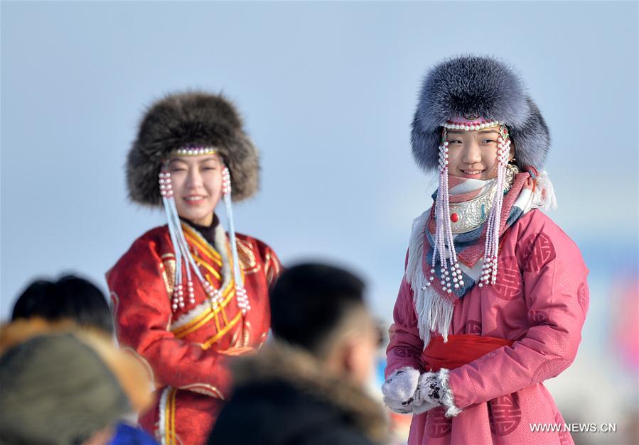 Two Mongolian girls present traditional costumes at the opening ceremony of a winter Nadam fair in West Ujimqin Banner, north China&apos;s Inner Mongolia Autonomous Region, Jan. 7, 2017. The 5-day event kicked off here on Saturday. Nadam Fair, meaning &apos;entertainment&apos; or &apos;recreation&apos; in Mongolian, is a mass traditional Mongolian festival mainly filled with sports events.(Xinhua/Ren Junchuan) 