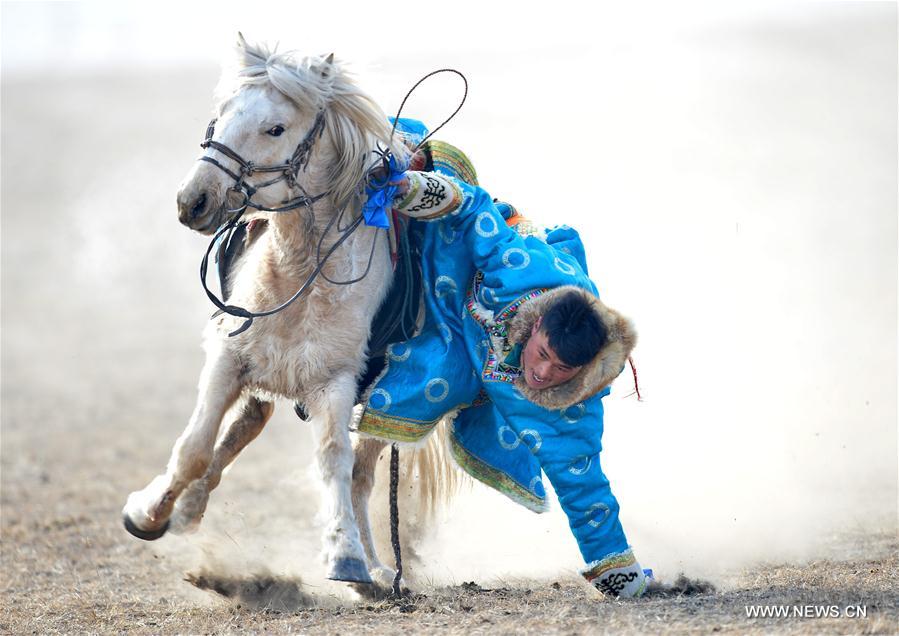 A Mongolian horseman performs at a winter Nadam fair in West Ujimqin Banner, north China&apos;s Inner Mongolia Autonomous Region, Jan. 7, 2017. The 5-day event kicked off here on Saturday. Nadam Fair, meaning &apos;entertainment&apos; or &apos;recreation&apos; in Mongolian, is a mass traditional Mongolian festival mainly filled with sports events.(Xinhua/Ren Junchua