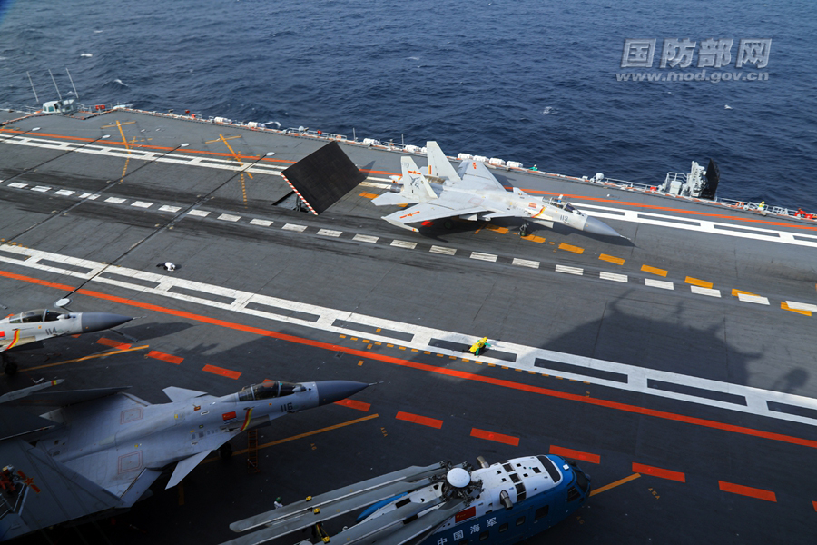 A J-15 carrier-based fighter jet prepares to take off from the Liaoning aircraft carrier during the vessel's latest training exercise. [Photo / MOD]