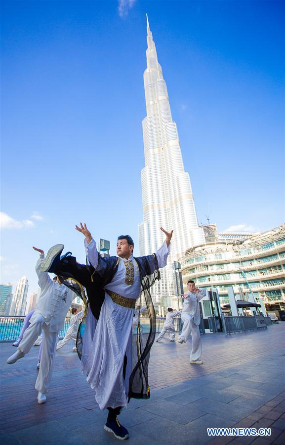 Participants take part in a flash mob of Chinese culture under the world's highest architecture Burj Khalifa tower in Dubai, United Arab Emirates, Jan. 15, 2017. [Photo/Xinhua]