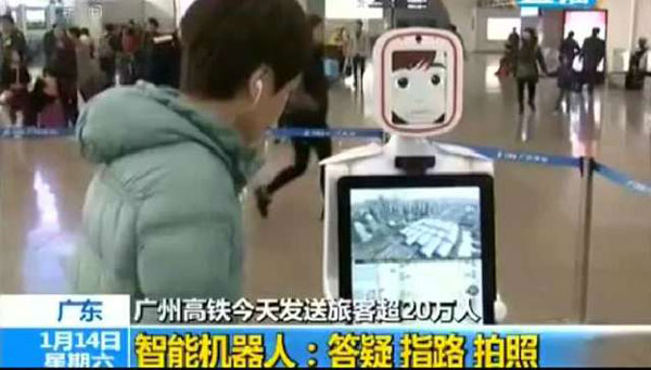 Passenger using a smart robot at Guangzhou South Railway Station, January 14th. [Photo: cctv.com]