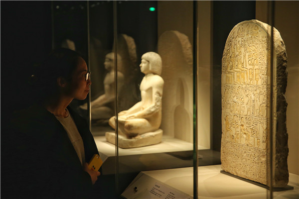 The Inventions of Louvre exhibition in Beijing features Egyptian stele. [Photo by Jiang Dong/China Daily]