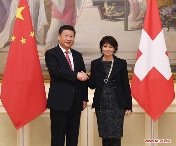 Chinese President Xi Jinping (L) shakes hands with his Swiss counterpart Doris Leuthard in Bern, Switzerland, Jan. 16, 2017. [Photo/Xinhua] 