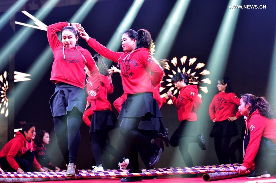 Residents dance at a community Spring Festival gala in Hefei City, east China's Anhui Province, Jan. 18, 2017. Residents from Changqing Subdistrict in Hefei staged a community Spring Festival gala to welcome the upcoming Lunar New Year. [Photo/Xinhua]