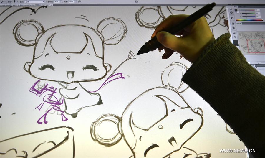 A comic artist draws drafts for comic works in Tianjin, north China, Jan. 18, 2017. As China's Spring Festival is coming, a comic team from Tianjin rolled out series comic works taking Spring Festival dolls as protagonists for the production of wechat expression package, clay sculpture and relevant derivatives. [Photo/Xinhua]