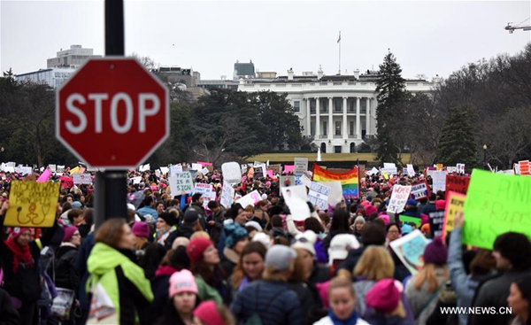 People participate in the Women's March protesting Trump's presidency following the inauguration of U.S. President Donald Trump, in Washington D.C., the United States, Jan. 21, 2017. About half a million people showed up for Women's March in the country's capital on Saturday to challenge the new U.S. president. [Photo/Xinhua]