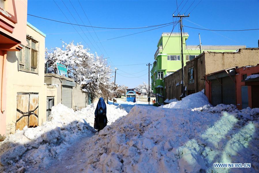 People walk on a street after a heavy snow in eastern Ghazni province, Afghanistan, Feb. 6, 2017. At least 100 people have lost their lives and more than 50 others sustained injuries due to snowfall and freezing weather over the past few days across Afghanistan, local media reported. (Xinhua/Sayed Mominzadah) 