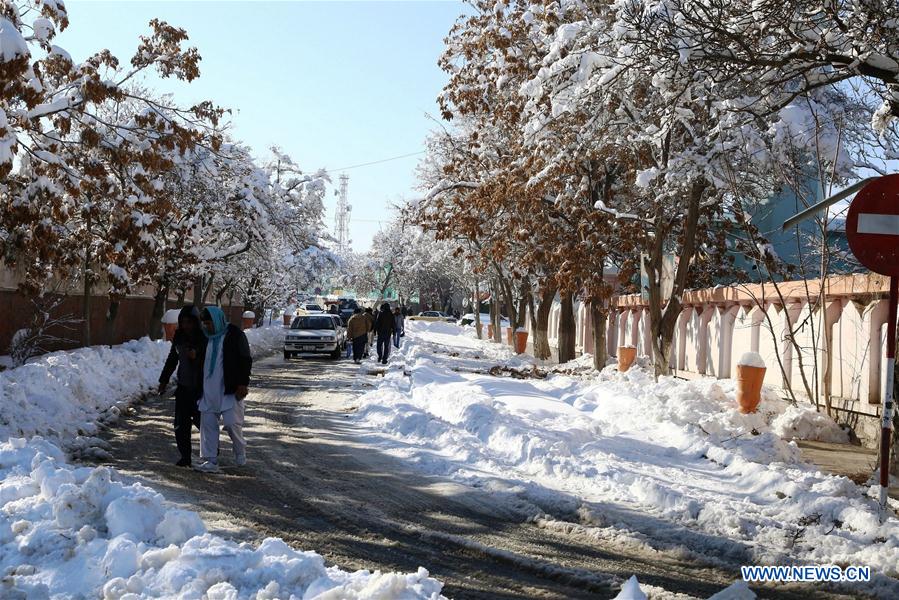 People walk on a street after a heavy snow in eastern Ghazni province, Afghanistan, Feb. 6, 2017. At least 100 people have lost their lives and more than 50 others sustained injuries due to snowfall and freezing weather over the past few days across Afghanistan, local media reported. (Xinhua/Sayed Mominzadah) 