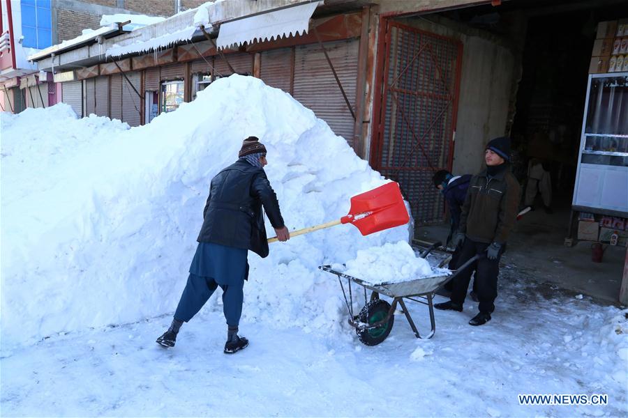 People clean the snow in eastern Ghazni province, Afghanistan, Feb. 6, 2017. At least 100 people have lost their lives and more than 50 others sustained injuries due to snowfall and freezing weather over the past few days across Afghanistan, local media reported. (Xinhua/Sayed Mominzadah) 