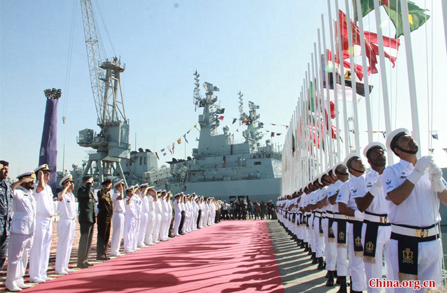 All foreign delegates saluting their national flags at the flag raising ceremony, which marks the opening of multinational naval exercise AMAN-17 at Pakistan Navy Dockyard in Karachi on Feb. 10, 2017. [China.org.cn / by Guo Xiaohong]