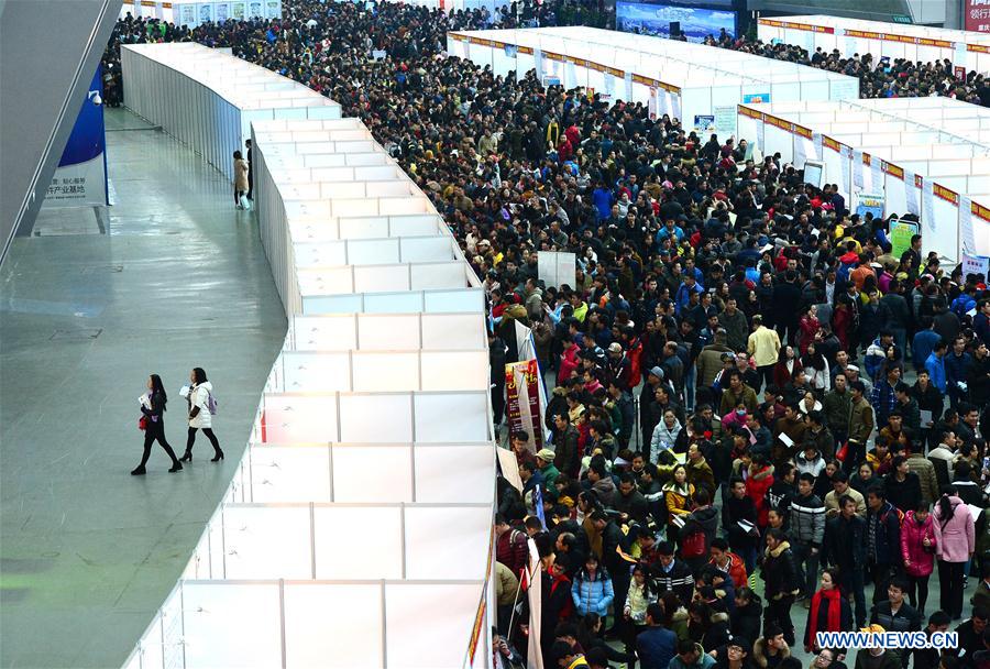 People seek job opportunities during a job fair in Liuzhou, south China's Guangxi Zhuang Autonomous Region, Feb. 10, 2017. Job fairs are held across China after the Spring Festival holiday. [Photo/Xinhua]