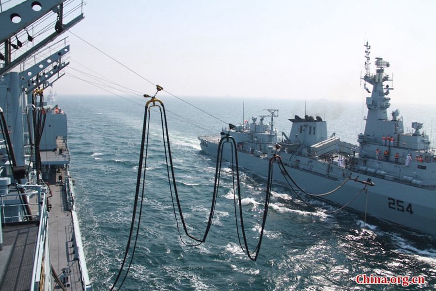 Pak Navy comprehensive supply ship PNS NASR performs the simultaneous refueling of two frigates. The AMAN-17 multinational naval exercise concludes with a spectacular exercise in the North Arabian Sea off Pakistan on Feb. 14, 2017. [Photo by Guo Xiaohong/China.org.cn] 