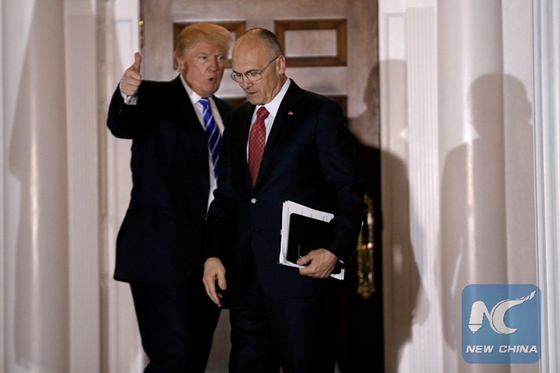 U.S. President-elect Donald Trump gestures as Andy Puzder, CEO of CKE Restaurants, departs after their meeting at the main clubhouse at Trump National Golf Club in Bedminster, New Jersey, U.S. on November 19, 2016. [Photo/Xinhua]