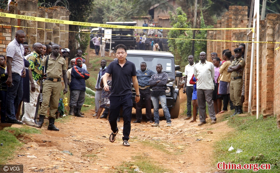 A Chinese official arrives at the crime scene in Makerere Kikoni, a neighborhood in the Ugandan capital of Kampala. [Photo/China.org.cn]