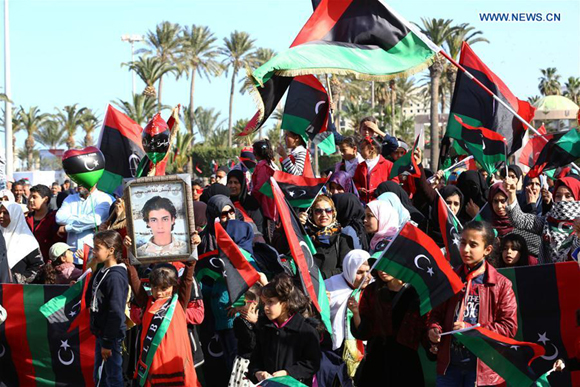 Libyans take part in a rally marking the sixth anniversary of the Libyan revolution in Tripoli, capital of Libya, on Feb. 17, 2017. (Xinhua/Hamza Turkia) 