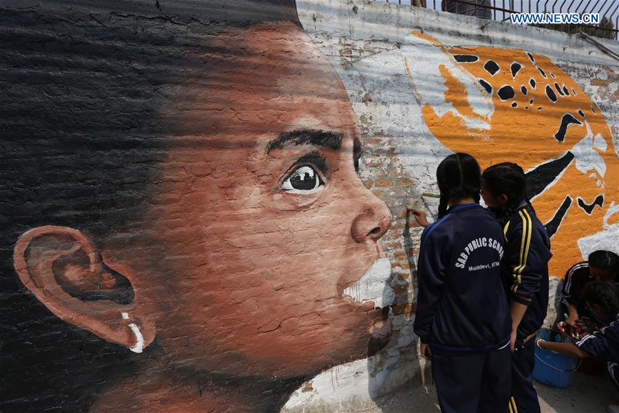 People draw on a wall during the &apos;Wall of Hope Campaign&apos; in Kathmandu, Nepal, Feb. 17, 2017. The art is prepared for the &apos;Wall of Hope campaign&apos;- a movement to help stop violence against women and bring awareness messages for the upcoming International Women&apos;s Day which is celebrated every year on March 8.(Xinhua/Sunil Sharma) 
