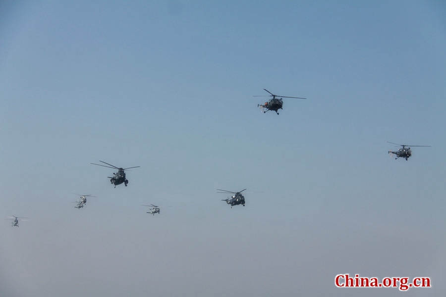 Helicopters from Pakistan, China, Russia, and Turkey performing a fly-past. The AMAN-17 multinational naval exercise concludes with a spectacular exercise in the North Arabian Sea off Pakistan on Feb. 14, 2017. [Photo by Guo Xiaohong/China.org.cn]