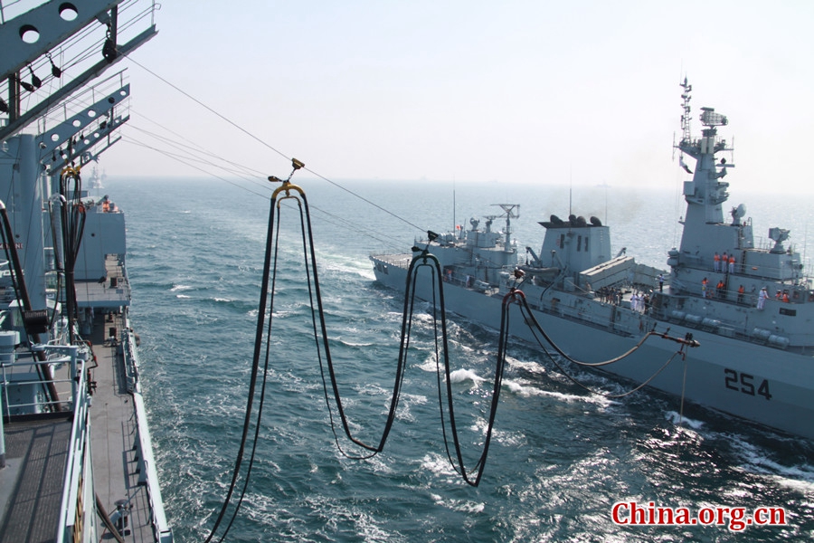 9895: Pak Navy comprehensive supply ship PNS NASR performs the simultaneous refueling of two frigates. The AMAN-17 multinational naval exercise concludes with a spectacular exercise in the North Arabian Sea off Pakistan on Feb. 14, 2017. [Photo by Guo Xiaohong/China.org.cn] 