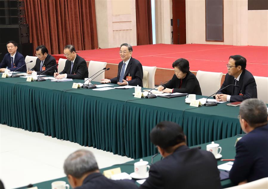 Yu Zhengsheng, chairman of the National Committee of the Chinese People's Political Consultative Conference (CPPCC), joins political advisors from the China Democratic League and personages without party affiliation in a panel discussion at the fifth session of the 12th National Committee of the CPPCC in Beijing, capital of China, March 6, 2017. (Xinhua/Ding Haitao)